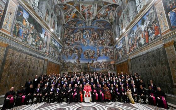 Pope Leo XIV poses for a group photo with members of the diplomatic corps accredited to the Holy See inside the Sistine Chapel at the Vatican Jan. 9, 2026. (CNS/Vatican Media)