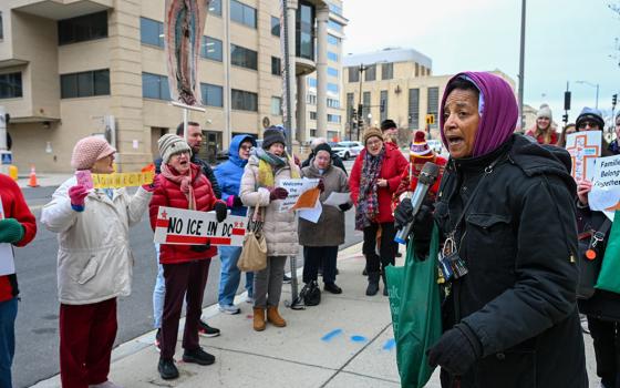 Charlene Howard, executive director of Pax Christi USA, leads community members during a prayer vigil outside the U.S. Immigration and Customs Enforcement headquarters in Washington Dec. 12, 2025. (OSV News/Leslie E. Kossoff)