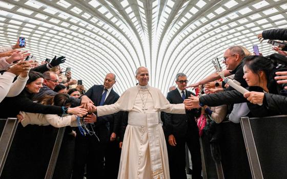 Pope Leo XIV greets people at the conclusion of his weekly general audience in the Paul VI Audience Hall at the Vatican Jan. 7, 2026. (CNS/Vatican Media)