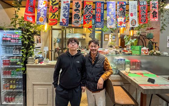 Kungfu Express owner LinNing Tang and his son Kevin in the restaurant in Rome. In the year leading up to his election to the papacy, Cardinal Robert Prevost — now Pope Leo XIV — would stop at Kungfu Express for his go-to meal. (Kielce Gussie)
