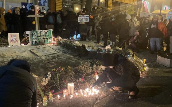 Participants gather at makeshift shrine for Alex Pretti Jan. 24 at a vigil in Minneapolis. (Tim Montgomery)