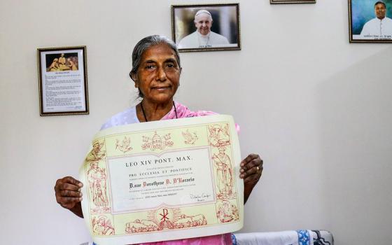 Dora D'Rozario, coordinator of the Order of Consecrated Virgins  in Bangladesh, shows her Pro Ecclesia et Pontifice Award from Pope Leo XIV in January. (Stephan Uttom Rozario)