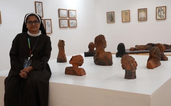 Sr. Roswin Joy, a member of the Congregation of the Mother Carmel, poses at the Kochi-Muziris Biennale pavilion in Kochi, Kerala, southwestern India. Her sculptures and drawings are on display at India's largest contemporary art exhibition featuring 66 artists from across the world. (Courtesy of Roswin Joy)