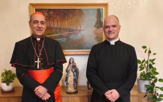 Cardinal Víctor Manuel Fernández, prefect of the Dicastery for the Doctrine of the Faith, and Fr. Davide Pagliarani, superior general of the traditionalist Society of St. Pius X, are pictured at the Vatican Feb. 12. (OSV News/Courtesy Dicastery for the Doctrine of the Faith)