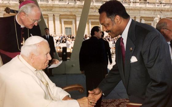 Pope John Paul II greets the Rev. Jesse Jackson at the end of the pope's weekly audience at the Vatican June 23, 1999. Jackson, a towering civil rights icon, died at age 84 Feb. 17. (OSV News photo/Vatican)
