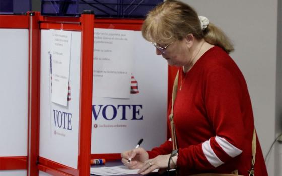 A woman fills out her ballot at an early voting station in Green Bay, Wis., March 19, 2025. (OSV News/Reuters/Eric Cox)