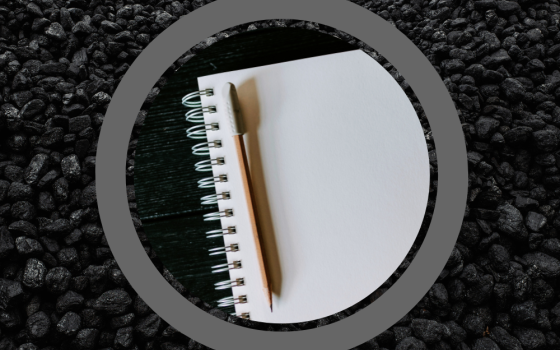 Photo of a notebook with a pencil on a background photo of coal (GSR graphic/Unsplash photos/Kelly Sikkema, Ottr Dan)