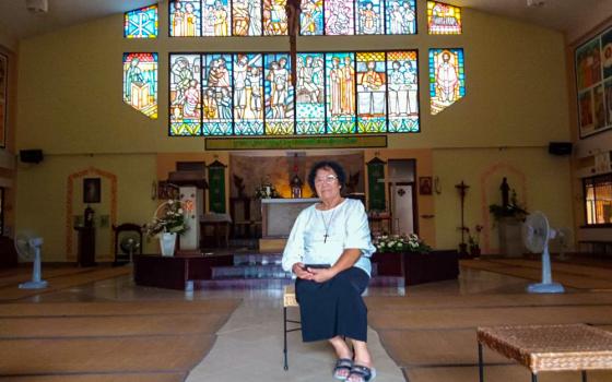 Sr. An Lucie Kim Nga poses for a photo in Child Jesus Catholic Church in Phnom Penh, Cambodia. The Vietnamese-born superior of the Sisters of Providence in Cambodia said she is driven by serving God and reconciliation between Cambodia and Vietnam. "If you have confidence in God, he will show you the way," she said.
