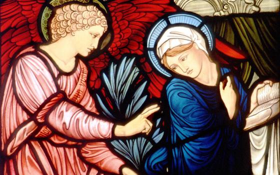 The angel Gabriel greets Mary in this church window depicting the Annunciation. (CNS photo from Crosiers)