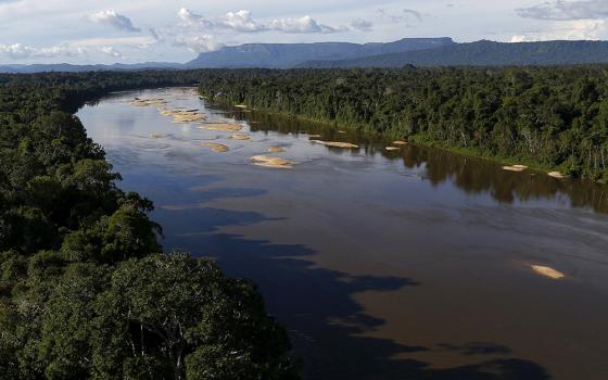 The Uraricoera River is pictured in a file photo during a Brazilian government operation against illegal gold mining on Indigenous land in the heart of the Amazon rainforest. (CNS/Reuters/Bruno Kelly)