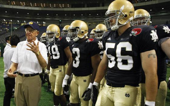 Notre Dame alumni coach Lou Holtz speaks to his team before the start of the Notre Dame Japan Bowl football game against Japan in Tokyo July 25, 2009. Holtz, a legendary college football coach and devout Catholic who led the University of Notre Dame to the 1988 National Championship, died March 4, 2026, at age 89. (OSV News/Reuters/Issei Kato)