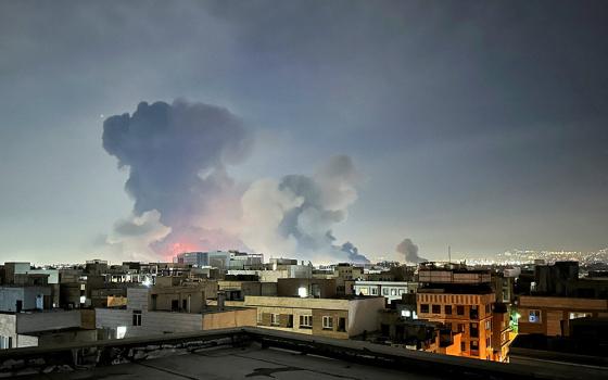 Smoke rises following an explosion in Tehran, Iran, March 7, 2026, amid the U.S.-Israel war with Iran. (OSV News/West Asia News Agency via Reuters/Naser Safarzadeh)