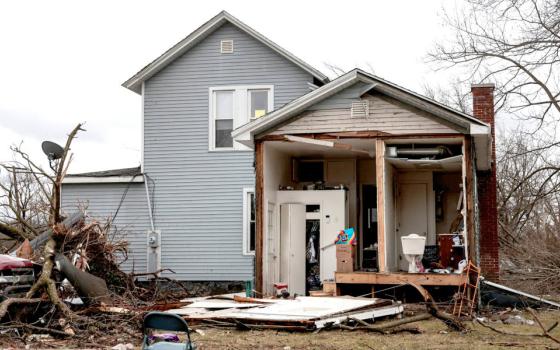Debris surrounds a damaged home in Three Rivers, Mich., March 7, 2026, following storms and tornado warnings. Powerful storms tore through parts of Michigan and Oklahoma, leaving a trail of destruction that included flattened homes and scattered debris. Volunteers helped residents sift through rubble and begin cleanup as the threat of severe weather lingered across the nation's midsection. (OSV News photo/Rebecca Cook, Reuters)