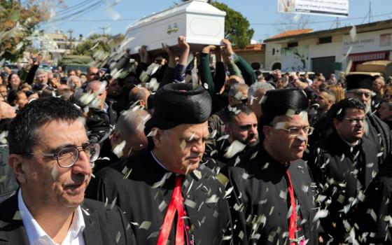 Mourners attend the funeral of Father Pierre al-Rahi, a priest who died of injuries he sustained from Israeli fire, according to medics and first responders, in Qlayaa, southern Lebanon, March 11, 2026, following an escalation between Hezbollah and Israel amid the U.S.-Israeli with Iran. (OSV News photo/Karamallah Daher, Reuters)