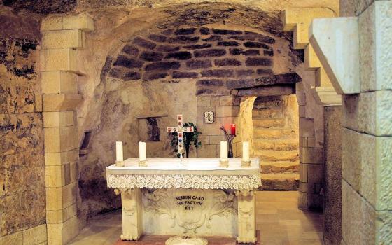 The Grotto of the Annunciation, beneath the Basilica of the Annunciation in Nazareth, pictured in December 2015, is believed to be the site where the angel Gabriel announced to Mary that she would conceive Jesus. The grotto contains first-century stone dwellings and draws pilgrims from around the world. (Mary Rose Kocab) 