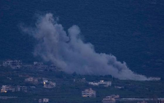 Smoke rises from an Israeli airstrike that hit Mansouri village as it is seen from Tyre city, south Lebanon March 26, 2026. (AP/Hussein Malla)
