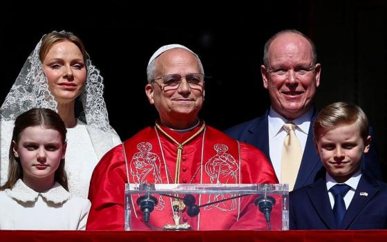 Pope Leo XIV greets the public with Prince Albert II of Monaco, Princess Charlene, Prince Jacques and Princess Gabriella at the Prince's Palace in Monaco-Ville, Monaco, March 28, during his second apostolic journey. The palace's state apartments were created in the 16th century and later remodeled on that of those at Versailles. (CNS/Lola Gomez)