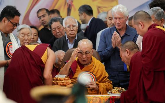 The 14th Dalai Lama, spiritual leader of Tibetan Buddhists, is served food on his 90th birthday celebration at the Dalai Lama Temple complex, in Dharamshala, India, July 6, 2025. The Dalai Lama has endorsed Pope Leo's message of peace. (OSV News/Reuters/Anushree Fadnavis)