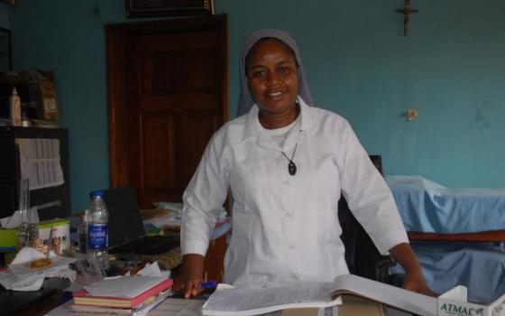 Sr. Nwanneka Udu, a member of the Congregation of the Medical Missionaries of Mary, poses in her office at the Mile Four Hospital in Abakaliki, Nigeria. She and other sisters and medical staff at the facility care for people with leprosy, including maternity and neonatal care, and other medical services. (Valentine Benjamin)