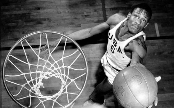 Bill Russell grabs a rebound. (Courtesy of the University of San Francisco)