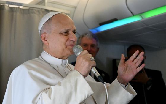 Pope Leo XIV addresses journalists during the flight heading to Algiers on April 13, 2026. Pope Leo XIV embarks on April 13 on an 11-day visit to Algeria, Cameroon, Angola and Equatorial Guinea for his first major international trip since becoming pontiff in May 2025. (OSV News/Alberto Pizzoli, Reuters)