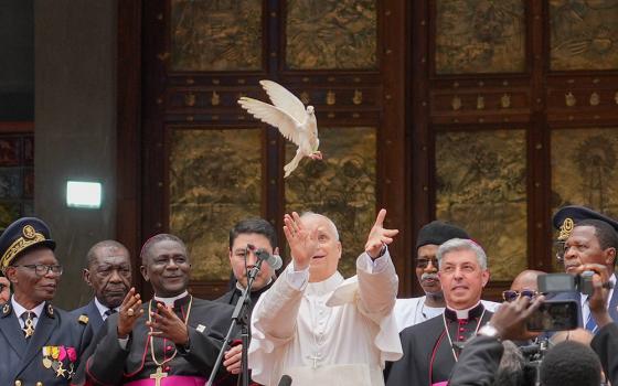 Pope Leo XIV releases a dove with community representatives at the conclusion of a peace meeting at St. Joseph Cathedral in Bamenda, Cameroon, April 16, 2026. (CNS/Lola Gomez)