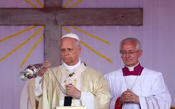 Pope Leo XIV swings a censer over the altar as he celebrates Mass at Saurimo esplanade in northeastern Angola April 20, 2026. (OSV News/Reuters/Guglielmo Mangiapane)