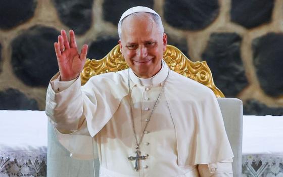 Pope Leo XIV waves as he attends a Meeting for Peace at St. Joseph's Cathedral in Bamenda, Cameroon, April 16, 2026. (OSV News/Reuters/Guglielmo Mangiapane)