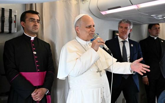 Pope Leo XIV speaks to journalists aboard a flight on his way to Luanda, Angola, April 18, 2026. On the flight from Cameroon to Angola, the pope pushed back against a media narrative that has pitted him against President Donald Trump since the start of his 11-day apostolic journey to Africa. (OSV News/Luca Zennaro, pool via Reuters)