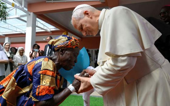 Pope Leo XIV greets an elderly woman during his visit to a nursing home in Saurimo, Angola, on April 20, 2026. (OSV News/Vatican Media/Simone Risoluti)