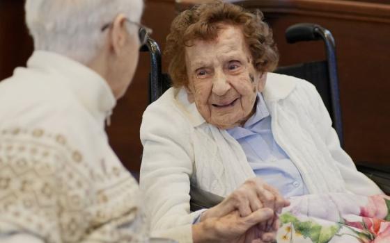 Sr. Francis Dominici Piscatella, right, a Sister of St. Dominic of Amityville, N.Y., who is recognized as the world's oldest nun, chats with Sr. Joanne Walters before attending Mass on her 113th birthday at the Dominican Sisters' motherhouse in Amityville April 20, 2026. (OSV News/Gregory A. Shemitz)