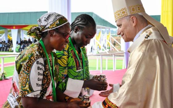 Pope Leo XIV receives the offertory gifts as he celebrates Mass at Bamenda International Airport in Cameroon April 16, 2026. (OSV News/Vatican Media/Simone Risolutii)