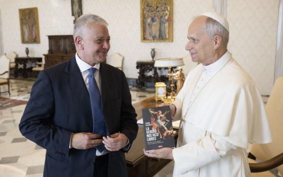 Pope Leo XIV meets with Pedro Salinas, a Peruvian journalist and abuse survivor, in the library of the Apostolic Palace at the Vatican Oct. 20, 2025. Salinas is a former member of Sodalitium Christianae Vitae who suffered physical and psychological abuse by the movement's founder, Luis Fernando Figari. (CNS/Vatican Media)