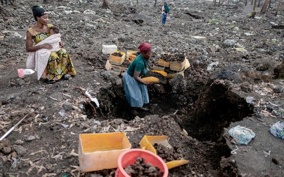 An internally displaced woman, who said she could not return home because it was destroyed during fighting, gathers volcanic gravel to sell at a camp in the Mugunga district, near Goma, in eastern Congo, March 22, 2025. The camp was emptied after M23 rebels ordered many displaced people to leave it and other camps. (OSV photo/Reuters/Zohra Bensemra)