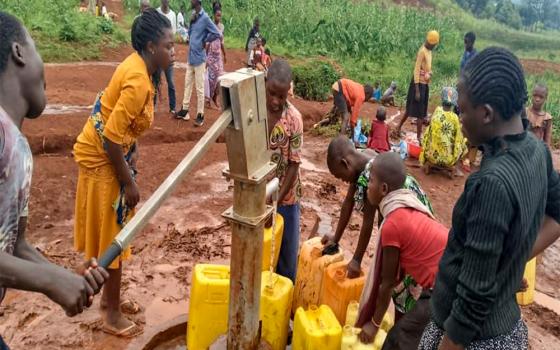 When improving access to water, local leadership is essential. Communities in Walungu Territory in South Kivu Province, Democratic Republic of Congo, form water committees to manage and maintain sources. Women play central roles — because they understand water needs best. (Courtesy of Namulisa Balaluka Rose)