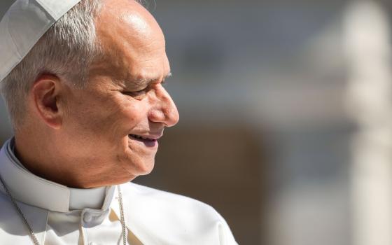 Pope Leo XIV smiles as he greets visitors and pilgrims from the popemobile while riding around St. Peter’s Square at the Vatican before his weekly general audience May 20, 2026. (CNS photo/Lola Gomez)