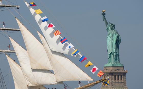 The Statue of Liberty is seen as Argentina's Ara Libertad sails past in the New York harbor during the International Parade of Sail, part of Sail250, a gathering of tall ships and military ships, Saturday, July 4, 2026, in New York. (AP photo/Yuki Iwamura)