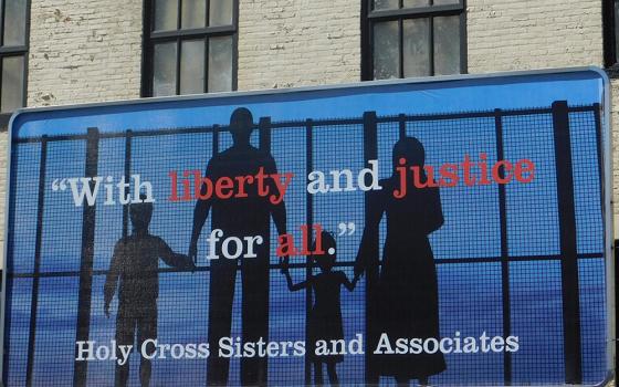 In this 2019 photo, a billboard sponsored by the Holy Cross Sisters and Associates is seen in Merrill, Wisconsin, to draw attention to the plight of immigrant families in the United States. (CNS photo/courtesy Holy Cross Sisters USA Province)