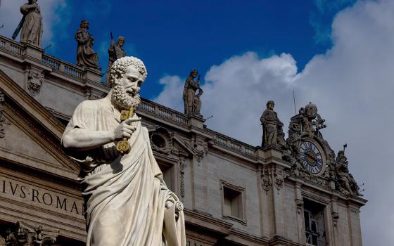 The sun lights up the statue of St. Peter in St. Peter's Square at the Vatican on a stormy Sept. 24, 2025, before Pope Leo XIV leads his weekly general audience. (CNS/Pablo Esparza)