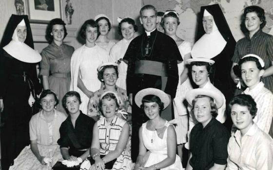 Archbishop Fulton J. Sheen is seen in an undated photo posing with women who worked at the Society for the Propagation of the Faith in New York City. (OSV News/Pontifical Mission Societies USA Archives)