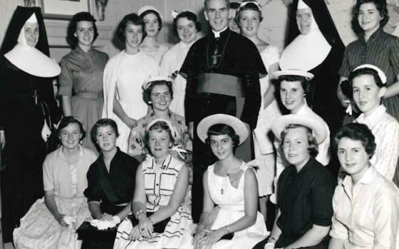 Archbishop Fulton J. Sheen is seen in an undated photo posing with women who worked at the Society for the Propagation of the Faith in New York City. (OSV News/Pontifical Mission Societies USA Archives)