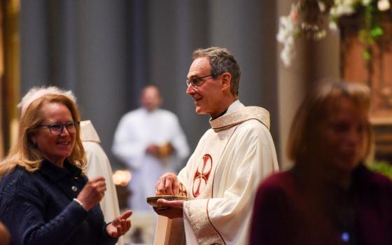 Jesuit Fr. Gregory Bonfiglio, pastor of St. Ignatius Parish in San Francisco, celebrates Mass in late April 2026. Bonfiglio wrote that the parish paying its assessment for the archdiocese's  settlement of clergy sex abuse cases was "an act of solidarity with survivors." (Courtesy St. Ignatius Parish)