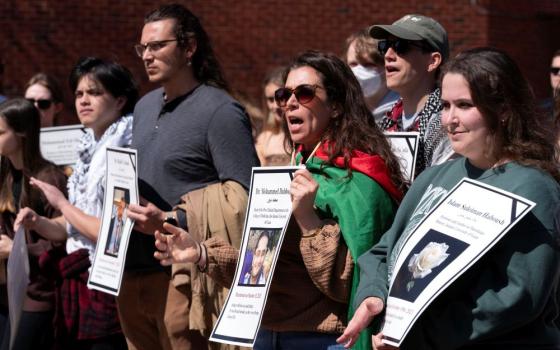 Georgetown University students hold pictures of people killed in Gaza as they rally in support of Badar Khan Suri, a Georgetown University professor, demanding his release from a deportation process over his views on Palestinian and the war in Gaza, at Georgetown University in Washington, March 25, 2025. (AP/Jose Luis Magana)