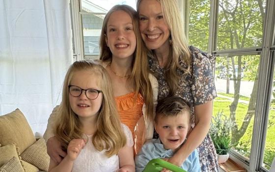 The author poses with her three children. (Courtesy of Sarah Kernion)