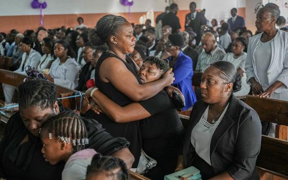 On Aug. 30, 2026, relatives attend the funeral ceremony for four victims of a gang attack in the Kenscoff neighborhood of Port-au-Prince, Haiti. (AP/Odelyn Joseph)