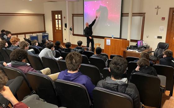 Jesuit in formation Rob Lorenz gives a presentation for Gonzaga College High School in Washington, D.C. (Courtesy of Ronald Jacobs)