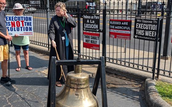 Kristen Hansen, minister of music, rings a bell in opposition to the death penalty outside First Evangelical Lutheran Church, Aug. 13, 2026, in downtown Nashville. (Courtesy of Death Penalty Action)