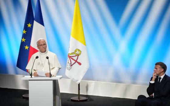 French President Emmanuel Macron, right, listens to Pope Leo XIV delivering his speech at the meeting At the Roots of Europe for Peace and Unity, Monday, Sept. 28, 2026, in Metz, France. (AP/Gregorio Borgia)
