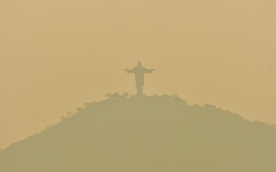 A statue of Christ of Peace atop San Pedro Hill is seen Sept. 10, 2024, shrouded in smoke caused by wildfires in Cochabamba, Bolivia. The Bolivian Bishops' Conference said in a statement the country was suffering from "an ecological disaster caused by human hands." (OSV News/Reuters/Patricia Pinto)