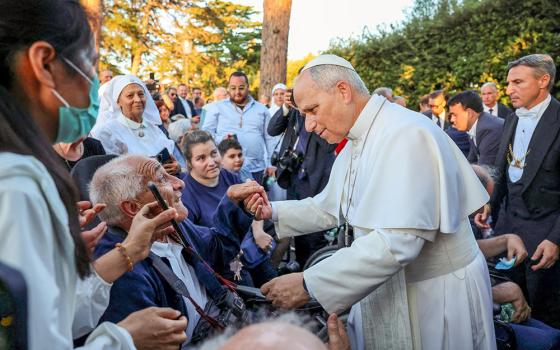 Pope Leo XIV greets the faithful after leading a worldwide rosary for peace at the Grotto of Our Lady of Lourdes in the Vatican Gardens May 30, 2026. (OSV News/Reuters/Yara Nardi)